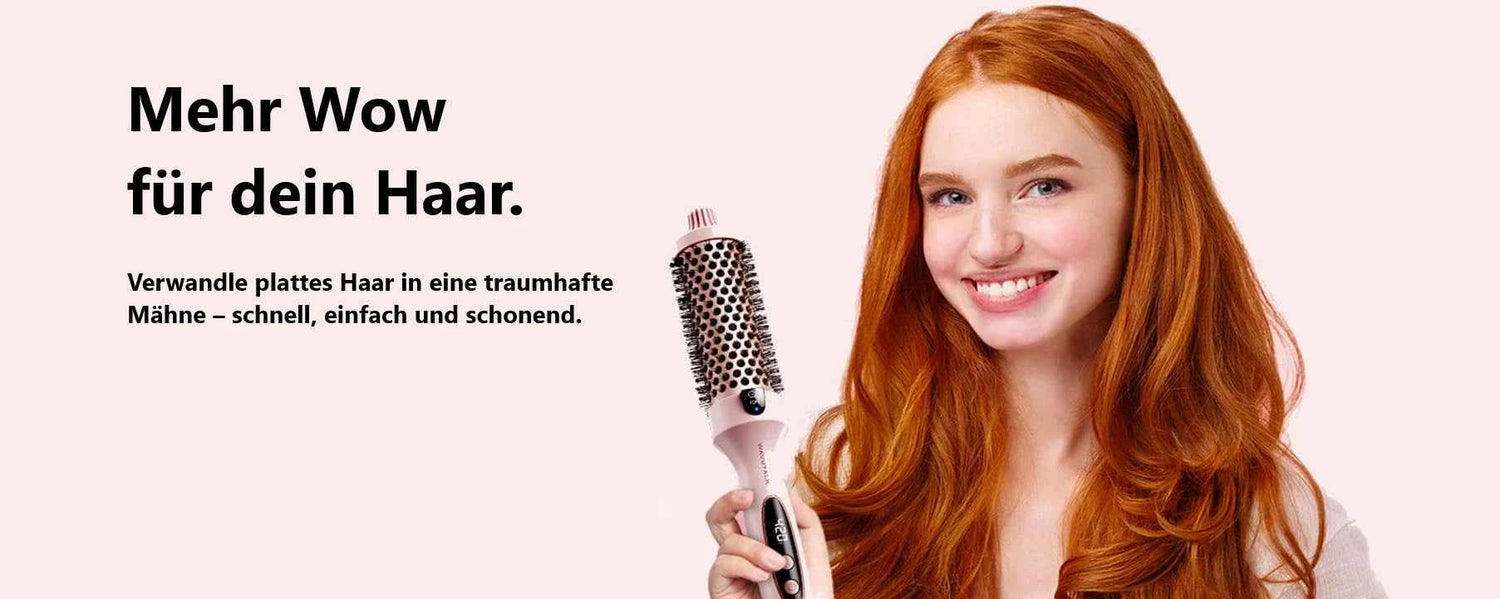 young woman red-haired smiling holding a round brush for a styling fast and voluminous.